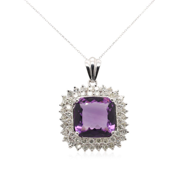 This necklace is crafted from 14k white gold and features a large cushion shaped amethyst surrounded by 3.65 total carats of diamonds.