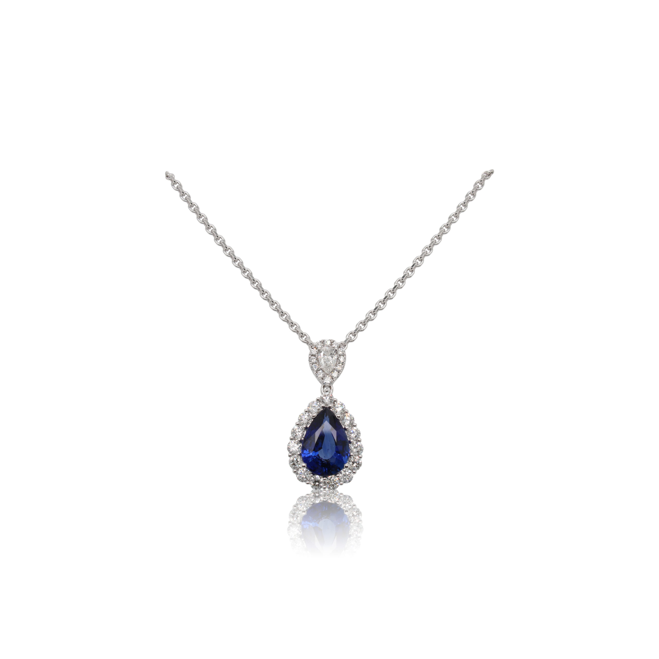 This necklace by Spark Creations is crafted from 18k white gold and features a 3.07 carat pear shaped sapphire and 1.05 total carats of diamonds around the halo.