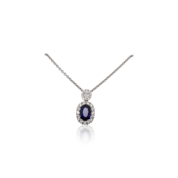 This necklace by Spark Creations is crafted from 18k white gold and features a 2.51 carat oval sapphire and 1.29 total carats of diamonds around the halo.