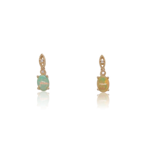 This pair of earrings is crafted from 14k yellow gold and features oval opals and diamond accents.