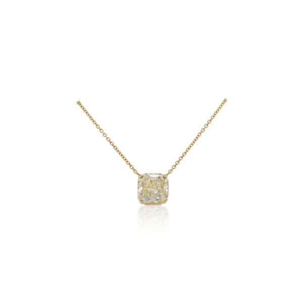This necklace is crafted from 18k yellow gold and features a 6.16 carat cushion shaped fancy yellow diamond.