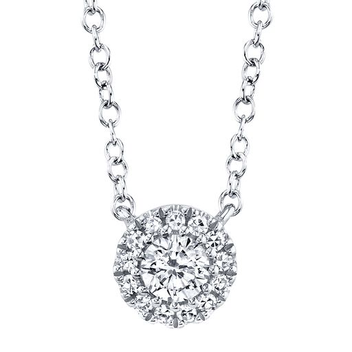 This necklace is crafted from 14k white gold and features 0.14 total carats of diamonds.