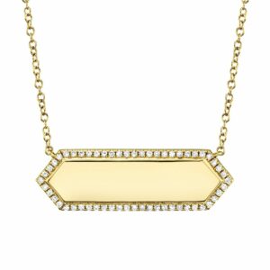 This necklace is crafted from 14k yellow gold and features 0.12 total carats of diamonds around an open area for engraving.