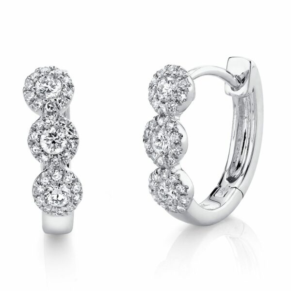 This pair of huggie hoop earrings is crafted from 14k white gold and features 0.37 total carats of diamonds.