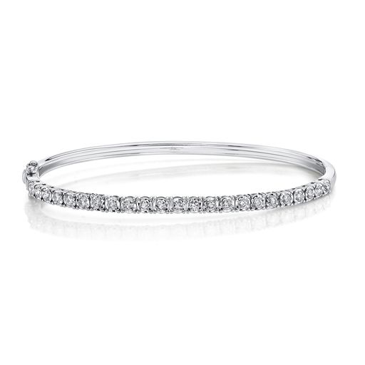 This bangle bracelet is crafted from 14k white gold and features 0.69 total carats of diamonds.