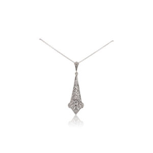 This necklace is crafted from 14k white gold and features a 0.11 carat old European cut diamond set in a filigree pendant.