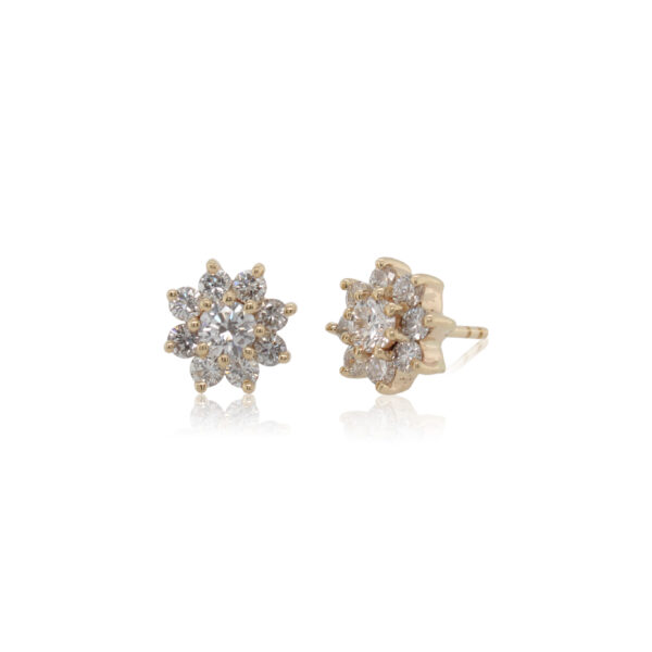 This pair of earrings is crafted from 14k yellow gold and features 1.30 total carats of diamonds.