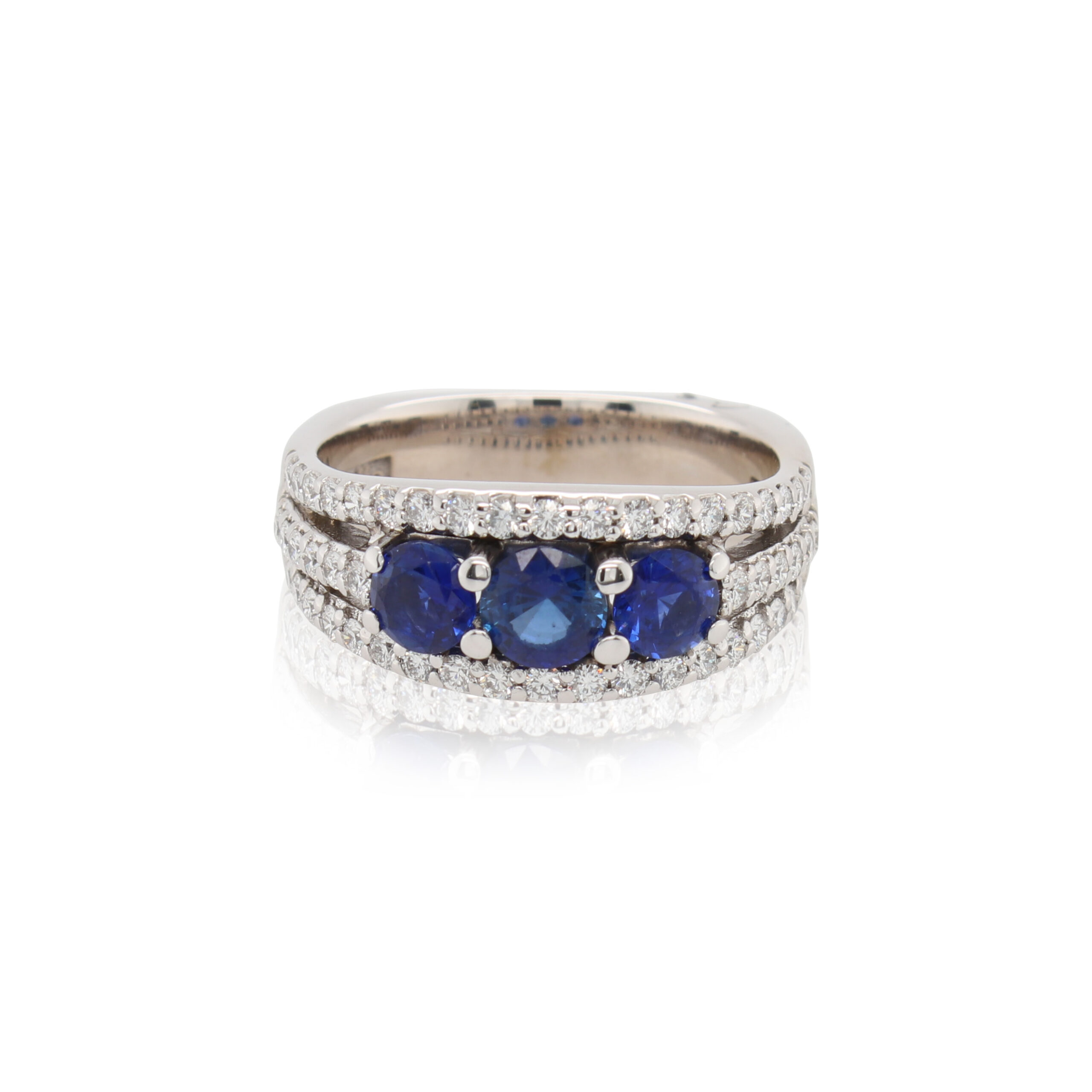 This ring is crafted from 18k white gold and features 3 sapphires that total to 1.15 carats and 0.50 total carats of diamonds.