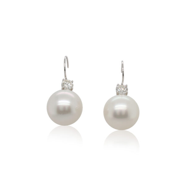 This pair of earrings is crafted from platinum and features two 16mm pearls and 1.20 total carats of diamonds.