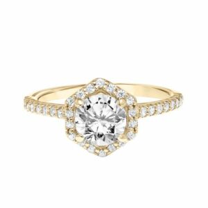 This engagement ring mounting by Goldman is crafted from 14k yellow gold and features 0.31 total carats of diamonds along the sides and around the halo. The center diamond is chosen separately.