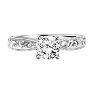 This engagement ring mounting by Goldman is crafted from 14k white gold and features intricate engraving along the sides. The center diamond is chosen separately.