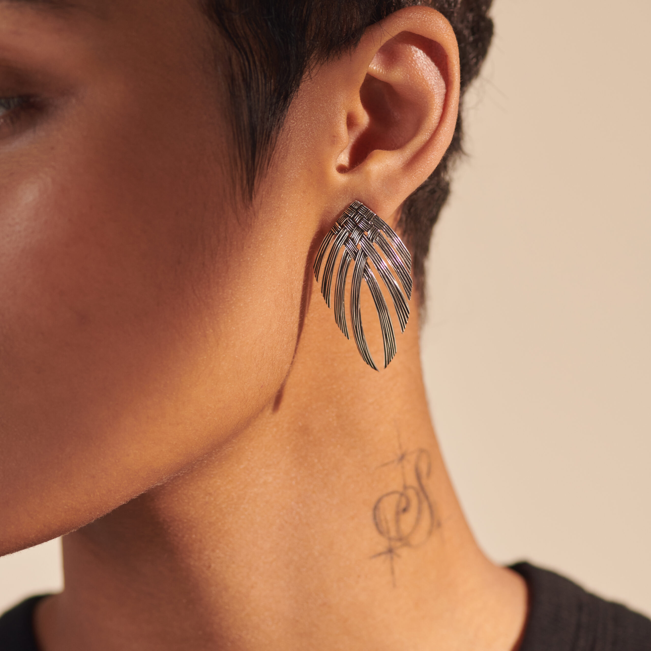 This pair of earrings by John Hardy is crafted from sterling silver and features a woven pattern.