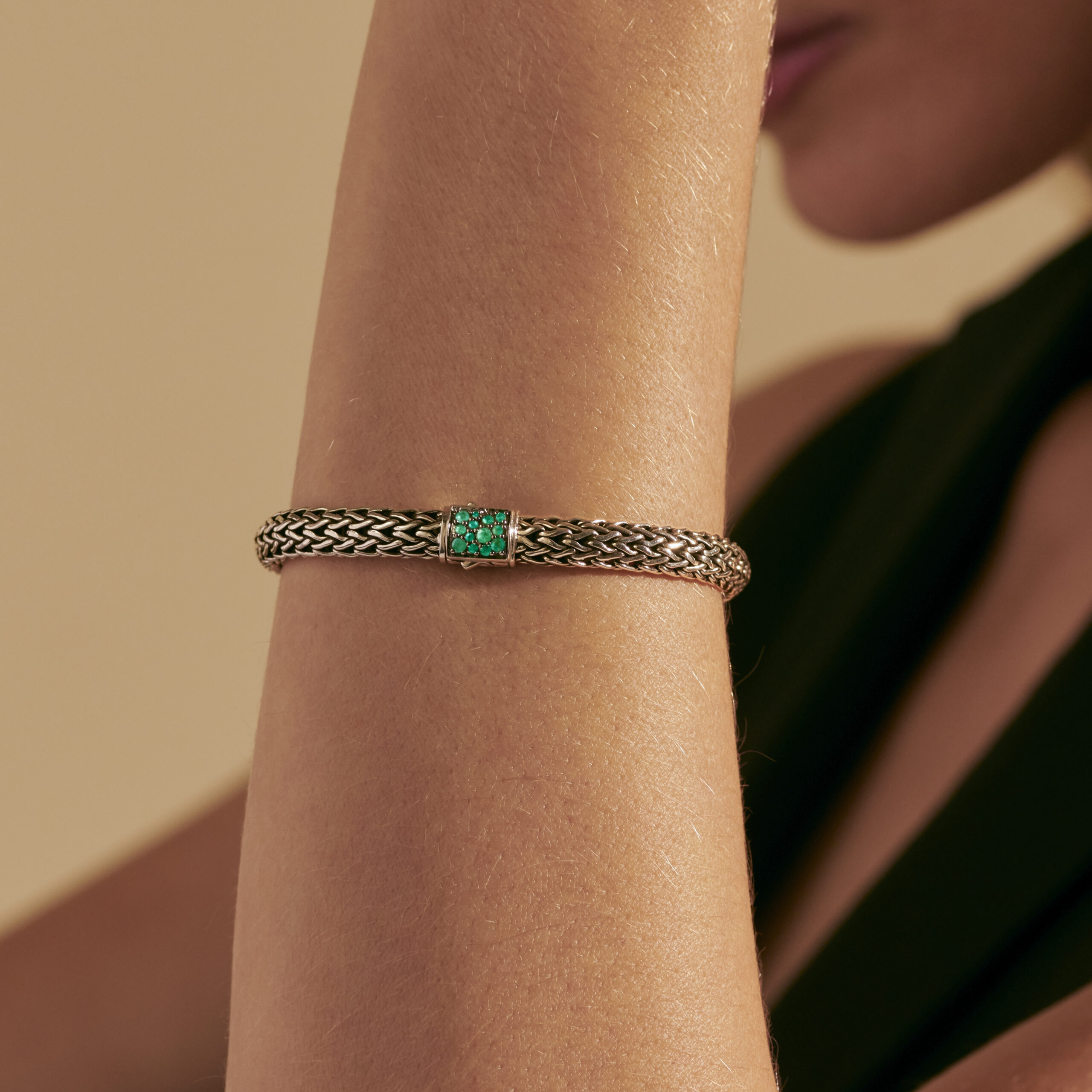 This reversible bracelet by John Hardy is crafted from sterling silver and features emerald and black sapphires in the clasp.