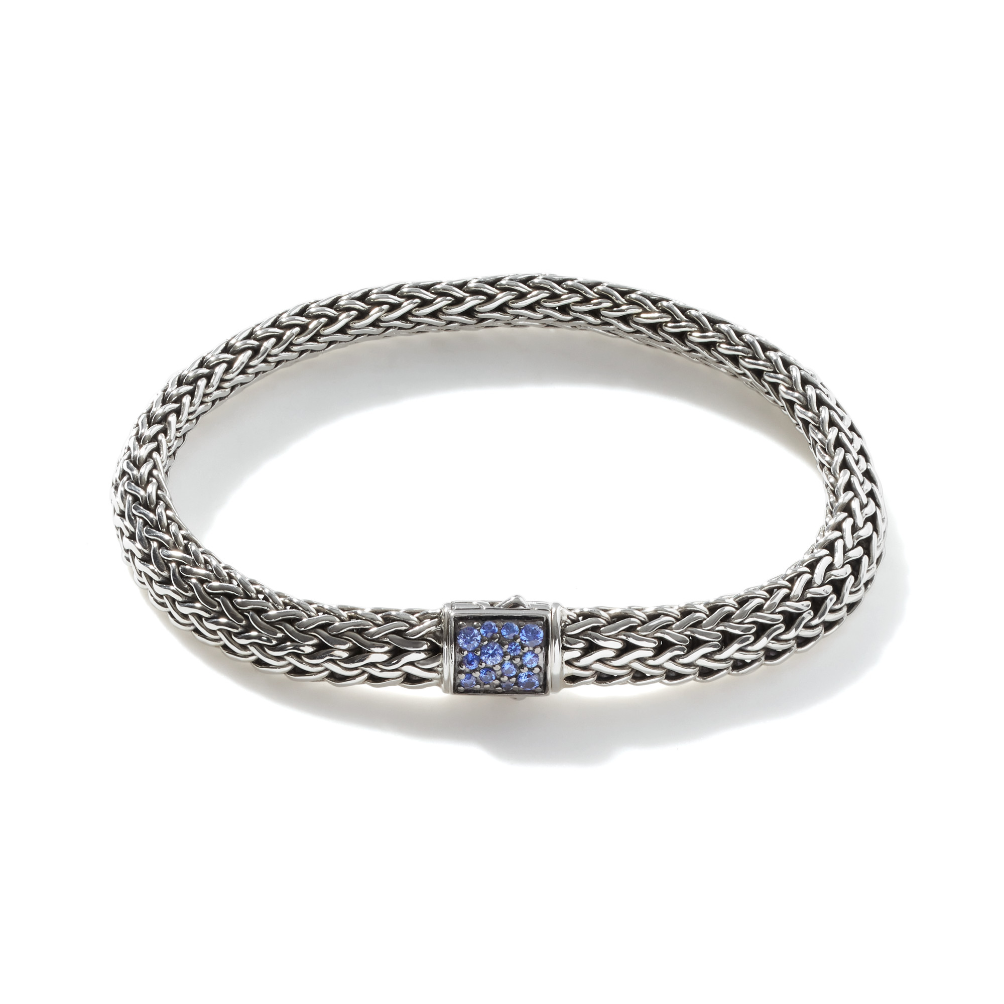 This bracelet by John Hardy is crafted from sterling silver and features black and blue sapphires in the clasp.